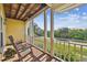 Cozy balcony featuring wooden rocking chairs and a glimpse of the peaceful outdoors at 6231 Bayshore Blvd, Tampa, FL 33611