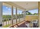 Inviting balcony with chairs and views of lush greenery and the ocean at 6231 Bayshore Blvd, Tampa, FL 33611