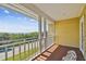 Charming balcony showcasing distant ocean views and comfortable outdoor seating at 6231 Bayshore Blvd, Tampa, FL 33611