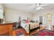 Well-lit bedroom features hardwood floors, ceiling fan, and natural light at 6231 Bayshore Blvd, Tampa, FL 33611