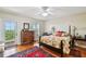 Spacious bedroom featuring hardwood floors, ceiling fan, and private balcony access at 6231 Bayshore Blvd, Tampa, FL 33611