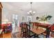 Elegant dining room with wooden table, chairs, and decorative lighting at 6231 Bayshore Blvd, Tampa, FL 33611