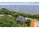 Stunning house with scenic waterfront view surrounded by mature trees and lush landscaping at 6231 Bayshore Blvd, Tampa, FL 33611