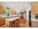 Bright kitchen featuring stainless steel appliances, wood cabinets, and a marble-top island at 6231 Bayshore Blvd, Tampa, FL 33611