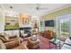 Comfortable living room featuring a fireplace, built-in shelving, and hardwood floors at 6231 Bayshore Blvd, Tampa, FL 33611