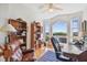 Comfortable home office features an ocean view from the large windows, a vintage desk, and ample storage at 6231 Bayshore Blvd, Tampa, FL 33611