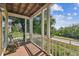 Inviting porch with a seating area and serene views of the surrounding greenery at 6231 Bayshore Blvd, Tampa, FL 33611