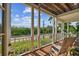 Charming porch with wooded views and comfortable seating at 6231 Bayshore Blvd, Tampa, FL 33611