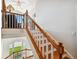 Elegant staircase with wood treads and white risers, leading to a sunlit landing at 6231 Bayshore Blvd, Tampa, FL 33611