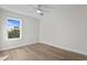 Bright bedroom with hardwood floors and window at 208 W Frances Ave # 1, Tampa, FL 33602