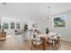 Open concept dining area with wood table and chairs, adjacent to living room at 208 W Frances Ave # 1, Tampa, FL 33602