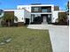 Modern two-story home with a large driveway and landscaped lawn at 1076 Snell Isle Ne Blvd, St Petersburg, FL 33704