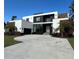 Modern two-story home with a large driveway and landscaped lawn at 1076 Snell Isle Ne Blvd, St Petersburg, FL 33704