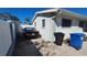 Rear exterior view showing driveway and trash bins at 4310 Huntington Ne St, St Petersburg, FL 33703