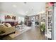 Spacious living room featuring hardwood floors and a decorative brick wall at 31093 Satinleaf Run, Brooksville, FL 34602