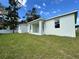 Covered patio and expansive grassy backyard at 37570 Teri Ct, Dade City, FL 33525