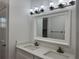 Bright bathroom with double vanity and updated fixtures at 37570 Teri Ct, Dade City, FL 33525