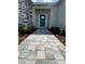 Inviting entryway with a stone walkway leading to the front door at 37570 Teri Ct, Dade City, FL 33525