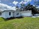 House exterior with stone accents and landscaping at 37570 Teri Ct, Dade City, FL 33525