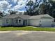 House exterior with stone accents and a two-car garage at 37570 Teri Ct, Dade City, FL 33525