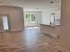 Open concept kitchen with white cabinets and island at 37570 Teri Ct, Dade City, FL 33525