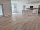 Open concept kitchen with white cabinets and island at 37570 Teri Ct, Dade City, FL 33525