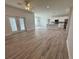 Open concept kitchen with white cabinets and island at 37570 Teri Ct, Dade City, FL 33525