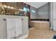Relaxing bathroom with soaking tub and neutral tile at 4114 W Zelar St, Tampa, FL 33629