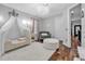 Charming bedroom with canopy bed and hardwood floors at 4114 W Zelar St, Tampa, FL 33629