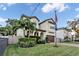 Two-story house with a brown door and lush landscaping at 4114 W Zelar St, Tampa, FL 33629