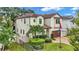 Two-story house with a brown door and tile roof at 4114 W Zelar St, Tampa, FL 33629