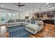 Bright living room and kitchen with hardwood floors and an open floor plan at 4114 W Zelar St, Tampa, FL 33629