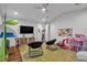 Playroom with hardwood floors, a TV, and plenty of space for toys at 4114 W Zelar St, Tampa, FL 33629