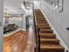 Elegant staircase with hardwood treads and black metal railing at 4114 W Zelar St, Tampa, FL 33629