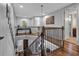 Bright upstairs hall with hardwood floors and stylish railing at 4114 W Zelar St, Tampa, FL 33629
