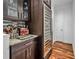 Wet bar with wine cooler and granite countertop at 4114 W Zelar St, Tampa, FL 33629