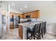 Kitchen with granite countertops, stainless steel appliances, wooden cabinets, and tile flooring at 1002 Pondview Ct, Tarpon Springs, FL 34689