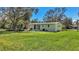 House with a large backyard and mature trees at 12020 82Nd E St, Parrish, FL 34219