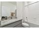 Bathroom with a tub, toilet, and granite vanity at 13204 Waterleaf Garden Cir, Riverview, FL 33579