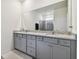 Bathroom with double vanity and granite countertop at 13204 Waterleaf Garden Cir, Riverview, FL 33579