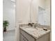 Small bathroom with granite countertop and single sink at 13204 Waterleaf Garden Cir, Riverview, FL 33579