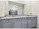 Bathroom with double vanity and granite countertop at 13204 Waterleaf Garden Cir, Riverview, FL 33579