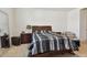 Bedroom with a double bed and wooden nightstands at 13204 Waterleaf Garden Cir, Riverview, FL 33579