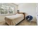 Bedroom with a bed, bookshelf, and chair at 13204 Waterleaf Garden Cir, Riverview, FL 33579