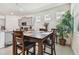 Bright breakfast nook with a wooden table and four chairs at 13204 Waterleaf Garden Cir, Riverview, FL 33579