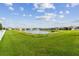 Community lake with fountain and lush landscaping at 13204 Waterleaf Garden Cir, Riverview, FL 33579