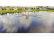 Aerial view of a community lake and fountain at 13204 Waterleaf Garden Cir, Riverview, FL 33579