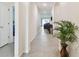 Foyer with tile floors and view of living area at 13204 Waterleaf Garden Cir, Riverview, FL 33579