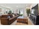 Spacious living room with sectional sofa and large TV at 13204 Waterleaf Garden Cir, Riverview, FL 33579