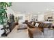 Spacious living room with sectional sofa and large TV at 13204 Waterleaf Garden Cir, Riverview, FL 33579
